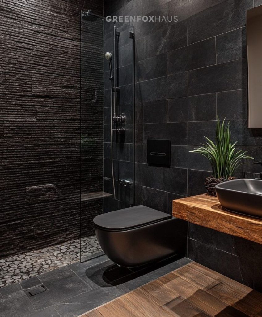 Mẫu thiết kế phòng tắm sử dụng gạch tông đen cắt 30×60 cho tường và nền khu vực ướt giúp không gian trông gọn, hiện đại và sạch sẽ. Phần khu vực khô được nhấn bằng gạch giả gỗ tông ấm, tạo cảm giác ấm áp, cân bằng lại sắc đen và làm phòng tắm có chiều sâu hơn. Cách phối này rất hợp cho nhà phố, căn hộ hiện đại, vừa đẹp vừa dễ dùng lâu dài.