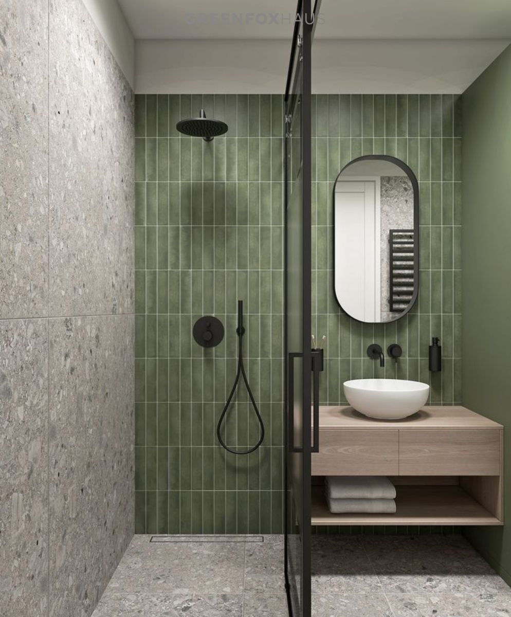 Ốp nền và tường bằng gạch terrazzo, sau đó nhấn thêm một mảng tường gạch thẻ xanh lá sẽ giúp không gian nổi bật hơn, vừa tươi mát, cá tính mà vẫn giữ tổng thể hiện đại và sạch thoáng.