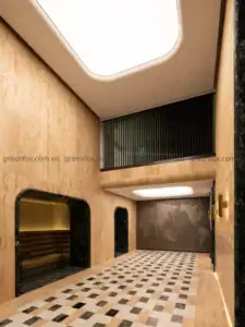 Gạch travertine kết hợp chi tiết đá đen tạo nên sảnh thương mại sang trọng, ấm cúng và đậm phong cách đương đại.