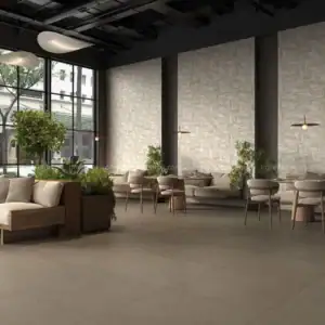 Nhà hàng hiện đại sử dụng gạch 3D màu kem khổ lớn 60x120 cm với họa tiết hình học nổi, kết hợp sàn porcelain xám và nội thất gỗ tối giản.
