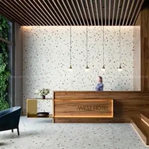 Quầy lễ tân khách sạn sử dụng gạch terrazzo lục giác màu trắng kết hợp hạt đá đa sắc trên mảng tường và sàn, tạo điểm nhấn hiện đại, sang trọng.