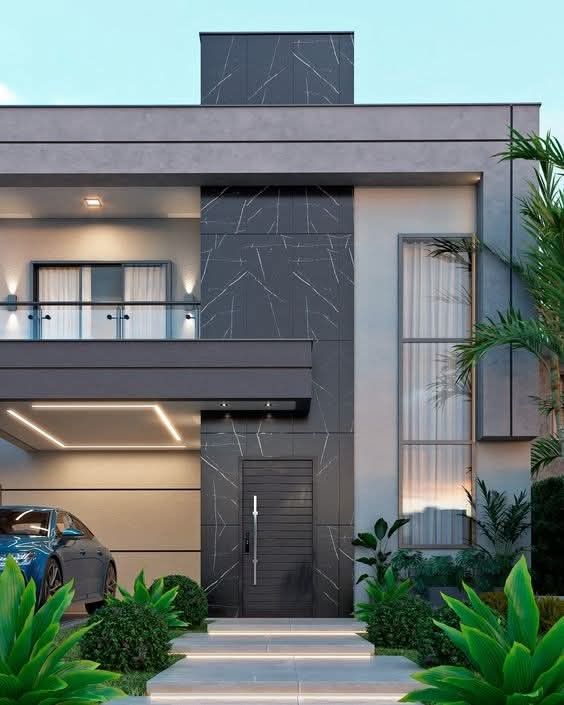 Mặt tiền nhà phố ốp gạch giả đá vân marble xám, phối cùng mảng sơn sáng giúp tổng thể hài hòa, hiện đại.