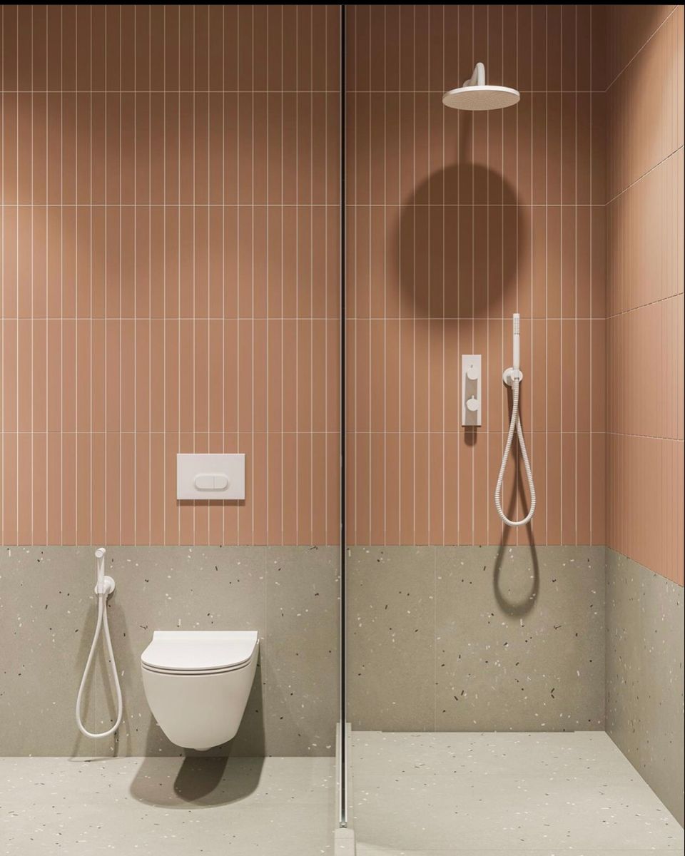 Gạch thẻ dọc màu terracotta phối terrazzo – ấm áp, cá tính, hợp nhà tắm phong cách contemporary.