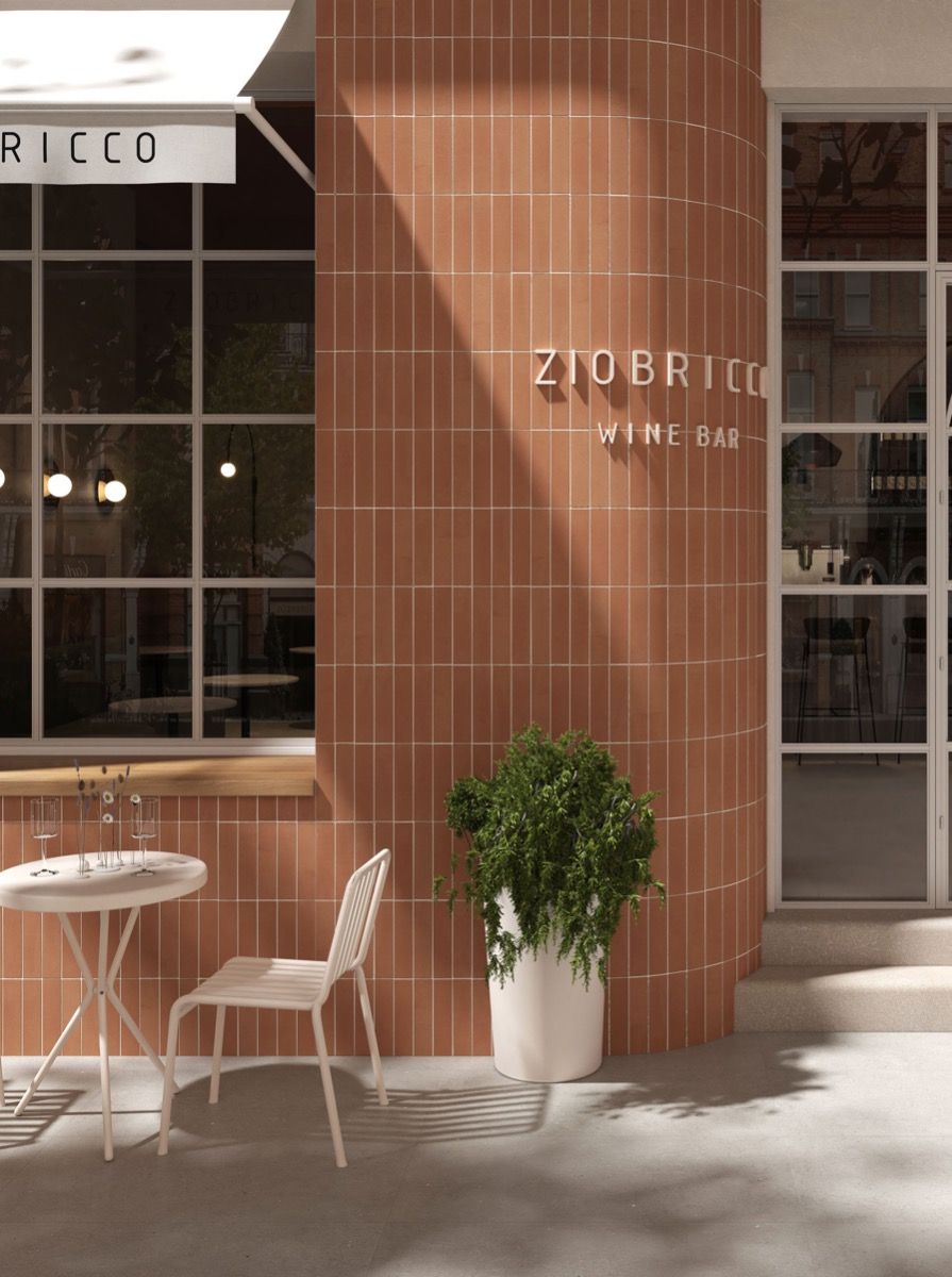 Mẫu gạch ốp tường ngoài trời đẹp tông terracotta bo cong, làm mặt tiền quán nổi bật và ấm 