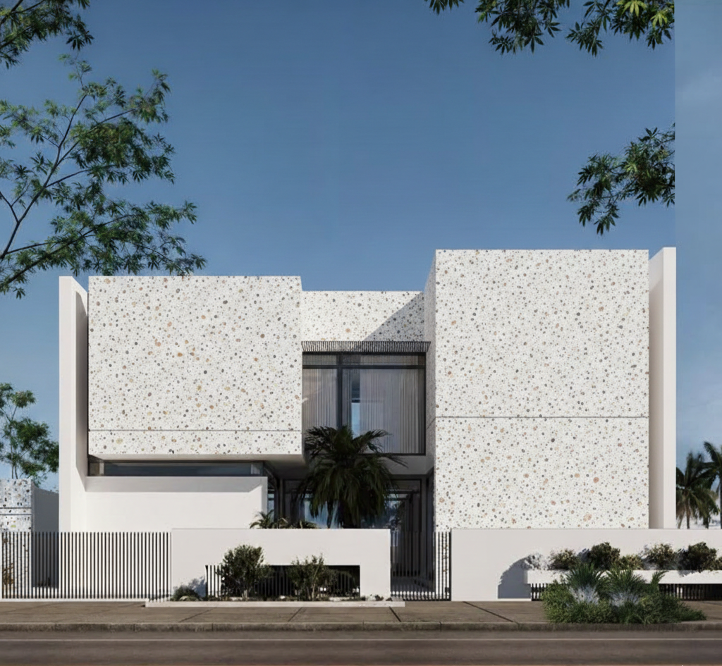 Gạch terrazzo trắng khổ lớn ốp full facade giúp tổng thể công trình sáng – sạch – nổi bật, bề mặt hạt màu tinh tế tăng chiều sâu kiến trúc khi nhìn từ xa.