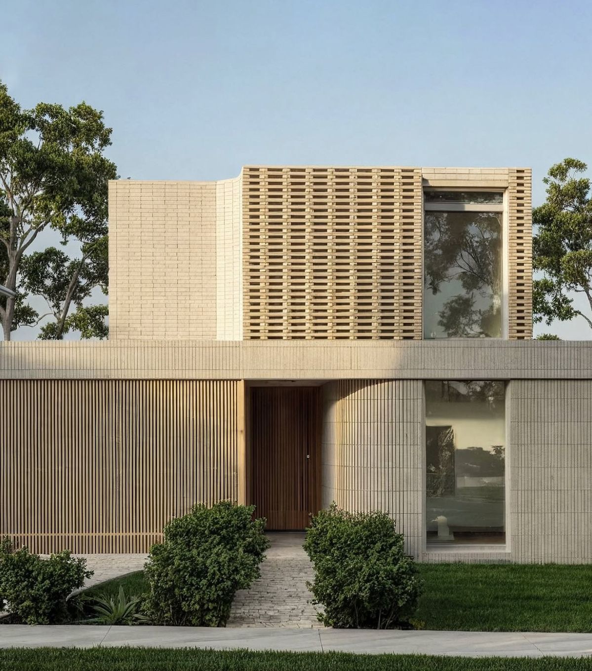 Mặt tiền nhà vườn ốp gạch subway trắng phối lam gỗ, cân bằng giữa nét hiện đại và ấm áp tự nhiên.