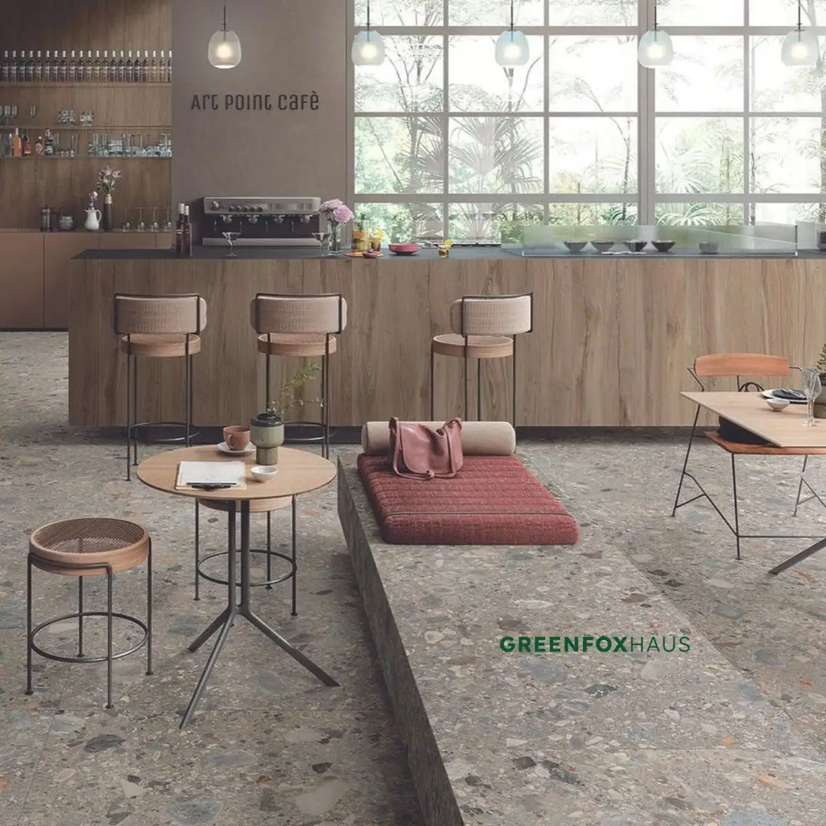 Gạch men terrazzo tone xám mộc mạc lát nền xuyên suốt quầy bar gỗ quán cà phê hiện đại
