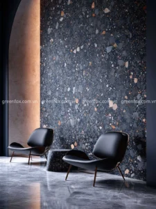 Gạch terrazzo đen hạt đá lớn ốp tường phòng khách hiện đại